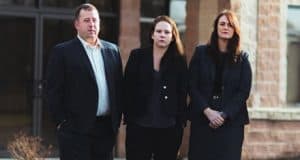 toledo criminal defense team standing outside office